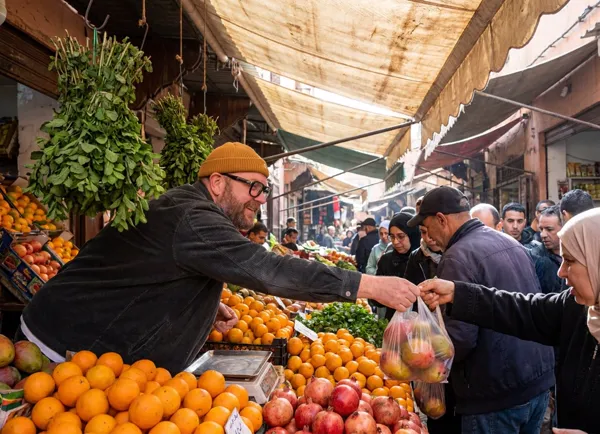 Busy fruit vendor in a bustling North African market