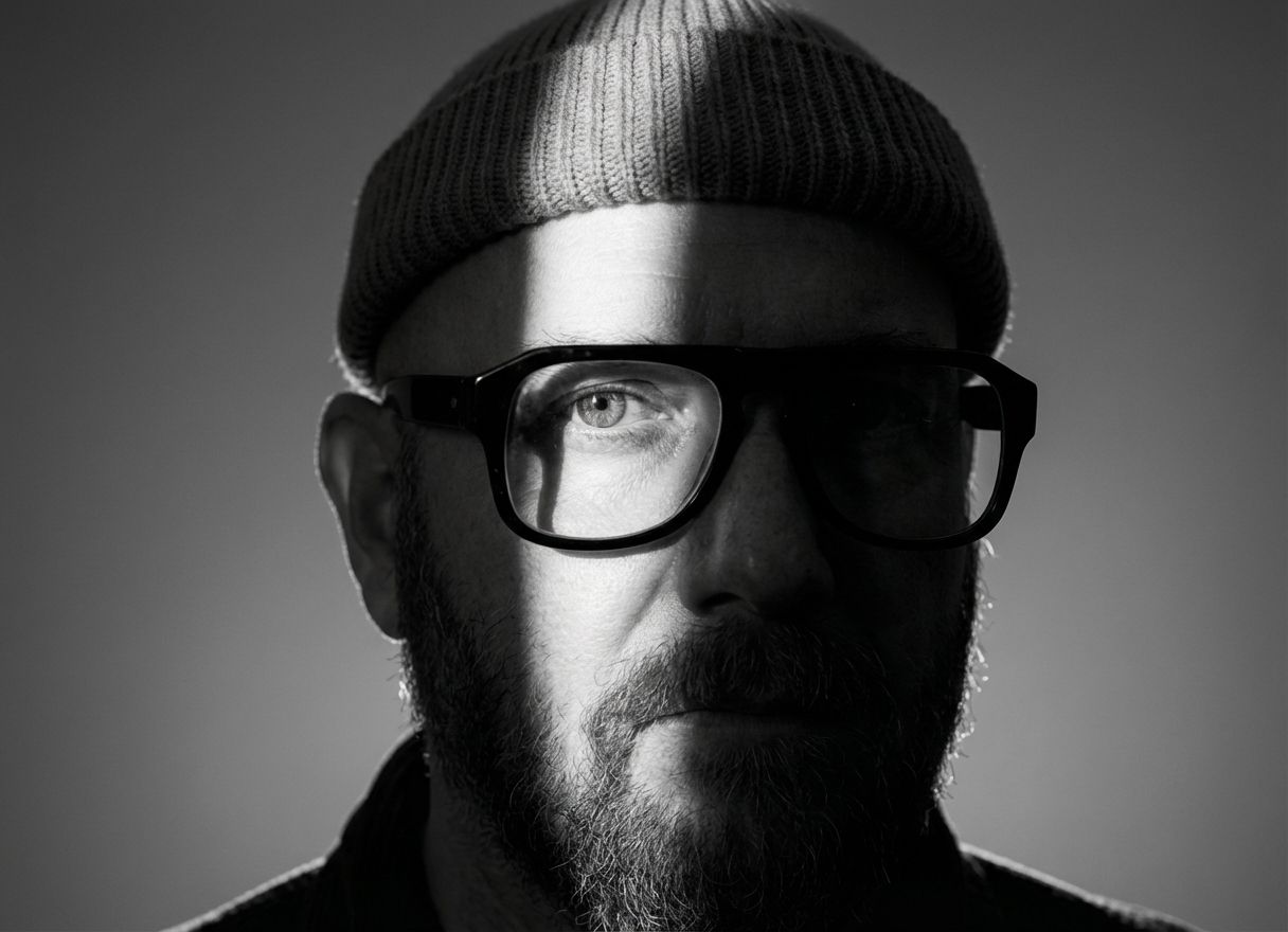 Dramatic black and white close-up portrait with stark lighting